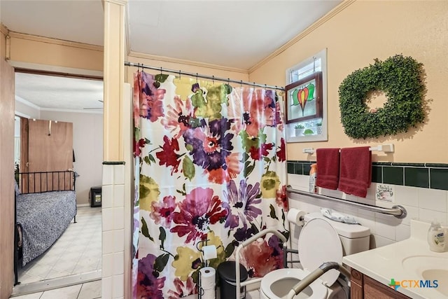 1309 Blackjack St, Lockhart, TX 78644 - bathroom with ornamental molding, toilet, vanity, and a shower with curtain