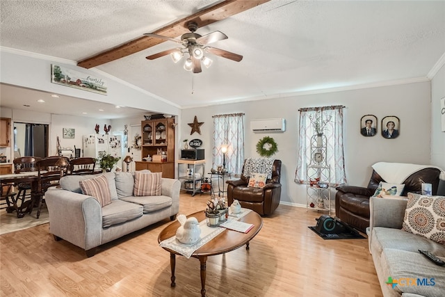 living room featuring a wall mounted AC, vaulted ceiling with beams, light wood-type flooring, a textured ceiling, and ceiling fan