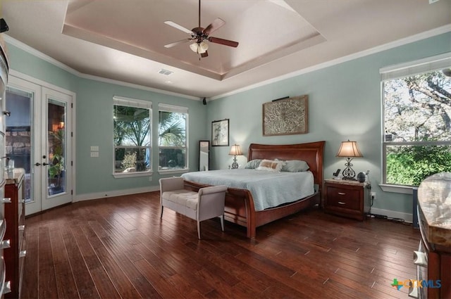 bedroom featuring a raised ceiling, ceiling fan, access to exterior, and dark hardwood / wood-style floors