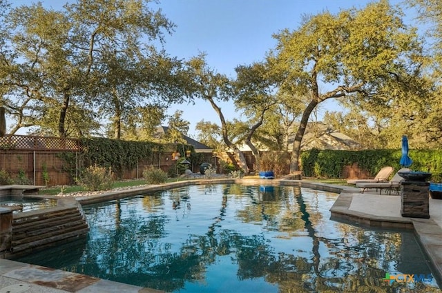 view of swimming pool featuring a patio