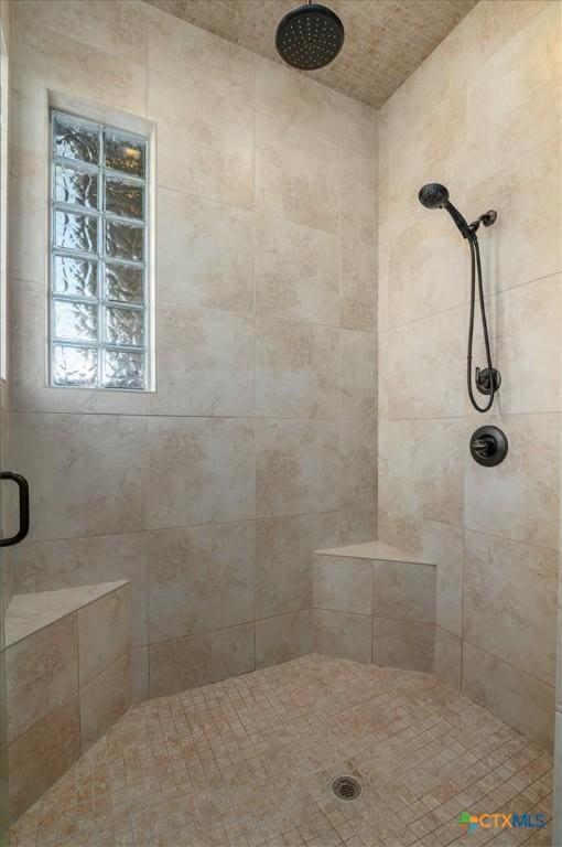 bathroom with a shower with shower door