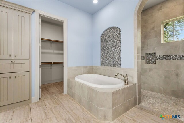1607 Filtro, New Braunfels, TX 78132 - bathroom featuring a garden tub, a walk in shower, recessed lighting, and a walk in closet