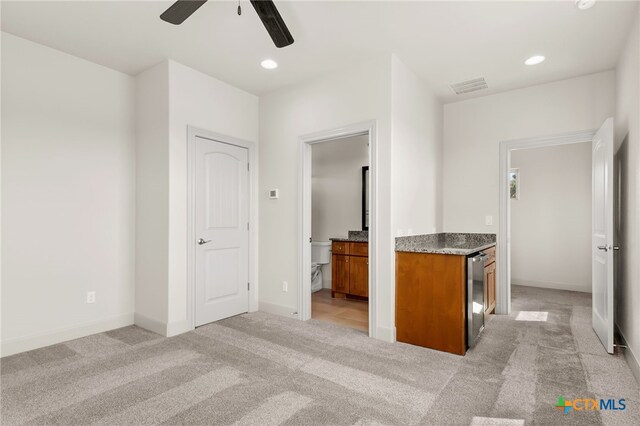 1607 Filtro, New Braunfels, TX 78132 - kitchen featuring ceiling fan, brown cabinets, light colored carpet, and recessed lighting