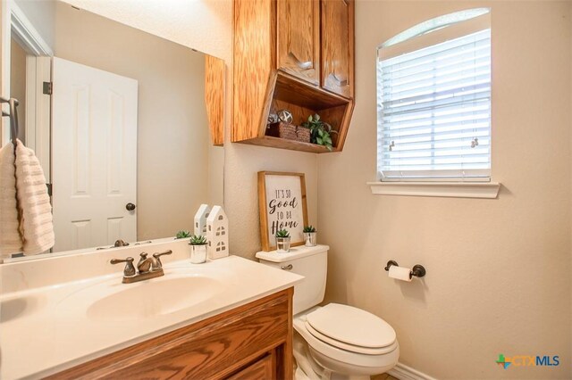 4901 Hammerstone Trl, Killeen, TX 76542 - bathroom with toilet, vanity, and baseboards