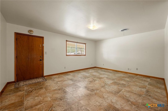201 Hillcrest Dr, Luling, TX 78648 - unfurnished room with stone finish flooring and baseboards