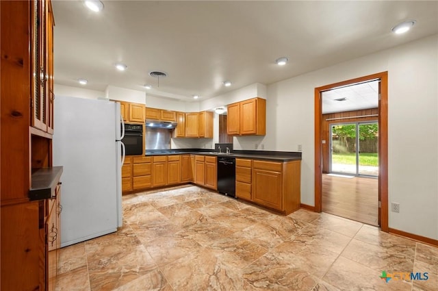 201 Hillcrest Dr, Luling, TX 78648 - kitchen featuring black appliances, dark countertops, baseboards, under cabinet range hood, and recessed lighting