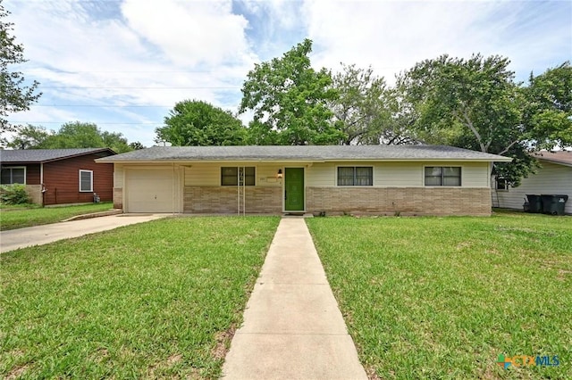 201 Hillcrest Dr, Luling, TX 78648 - ranch-style home featuring brick siding, concrete driveway, a front lawn, and a garage