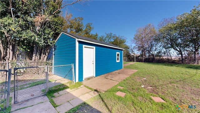 view of outbuilding featuring a yard