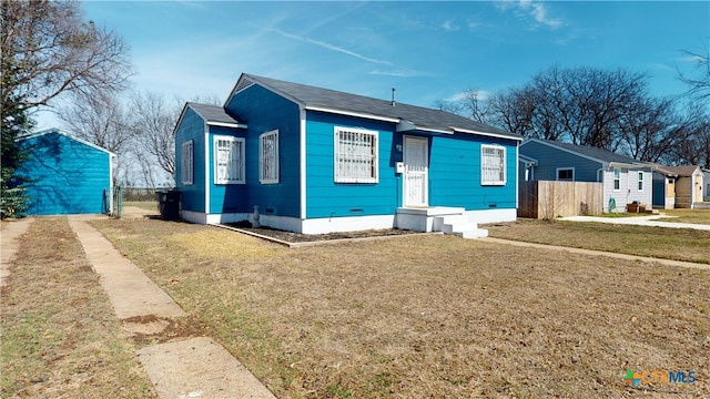 bungalow with a front yard