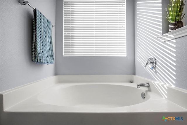 bathroom with a washtub