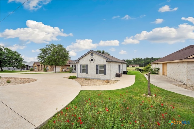 460 Shayla Ln, Canyon Lake, TX 78133 - view of side of home with a lawn and brick siding
