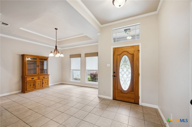 460 Shayla Ln, Canyon Lake, TX 78133 - entryway featuring a chandelier, ornamental molding, a raised ceiling, and light tile patterned floors