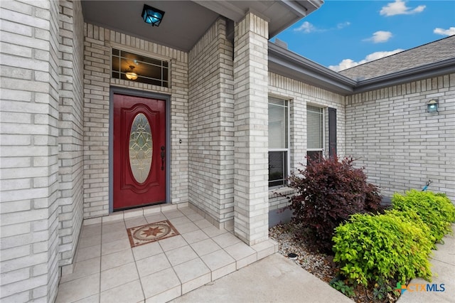 460 Shayla Ln, Canyon Lake, TX 78133 - doorway to property featuring brick siding and a shingled roof