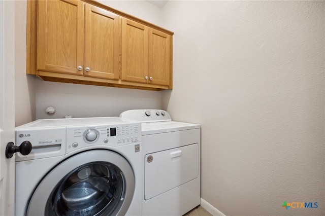460 Shayla Ln, Canyon Lake, TX 78133 - laundry area with cabinet space and washing machine and dryer