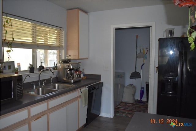 kitchen with sink, white cabinets, black appliances, and dark hardwood / wood-style floors