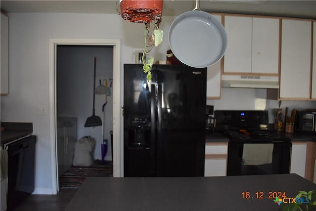 kitchen with white cabinets and black appliances