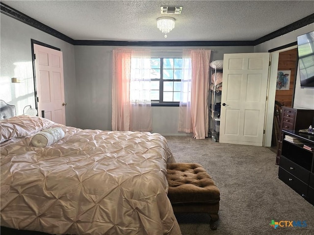 bedroom with carpet flooring and a textured ceiling