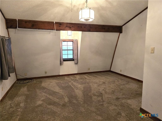 carpeted spare room with lofted ceiling with beams and a textured ceiling