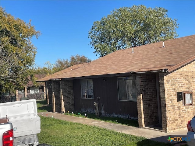 view of home's exterior featuring a yard