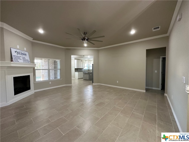 unfurnished living room with ceiling fan and crown molding