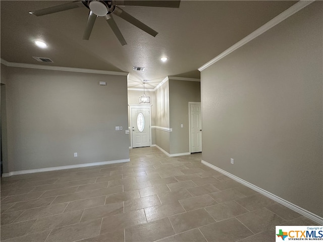 unfurnished living room with ceiling fan, tile patterned floors, and ornamental molding