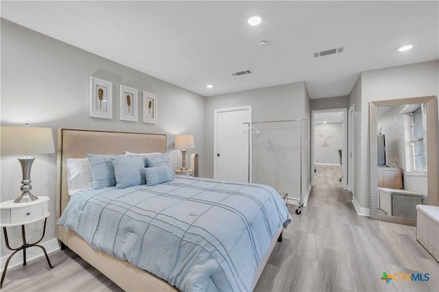 735 Slawson Ln, Killeen, TX 76542 - bedroom with light wood finished floors, a closet, baseboards, and recessed lighting