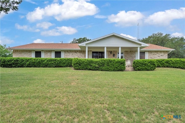 735 Slawson Ln, Killeen, TX 76542 - ranch-style home featuring a front lawn, brick siding, and a porch