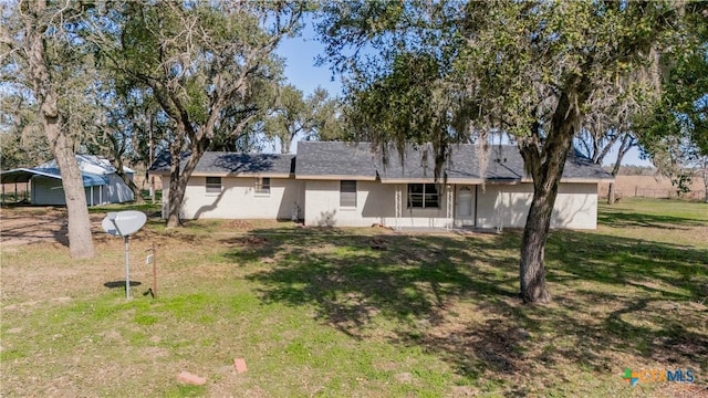 exterior space featuring a front lawn