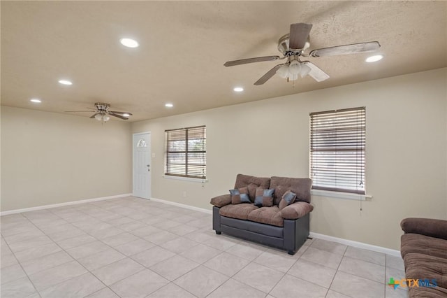 interior space featuring a textured ceiling and ceiling fan