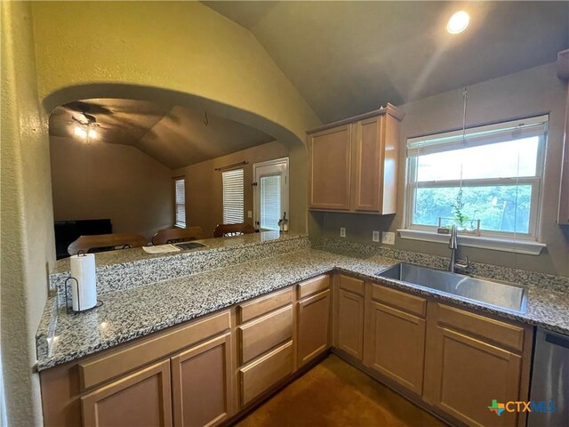 kitchen with sink, appliances with stainless steel finishes, and concrete floors