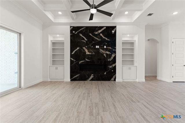 112 Vista De Luna Ln, Belton, TX 76513 - unfurnished living room with built in features, arched walkways, crown molding, baseboards, and coffered ceiling