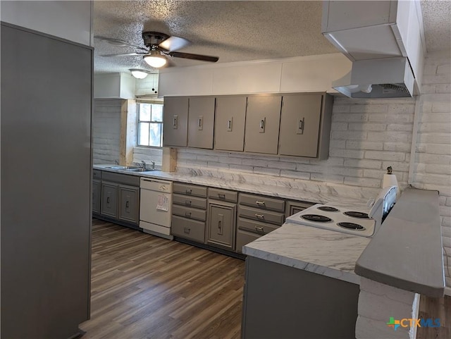 1201 Oblate Dr, Canyon Lake, TX 78133 - kitchen featuring white appliances, gray cabinetry, custom range hood, a textured ceiling, and ceiling fan