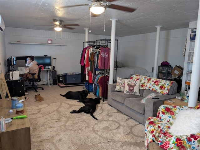 1201 Oblate Dr, Canyon Lake, TX 78133 - carpeted living room with a ceiling fan, an office area, and concrete block wall