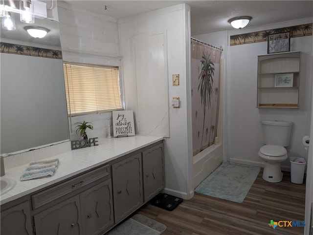 1201 Oblate Dr, Canyon Lake, TX 78133 - bathroom featuring wood finished floors, toilet, shower / bath combination with curtain, and vanity