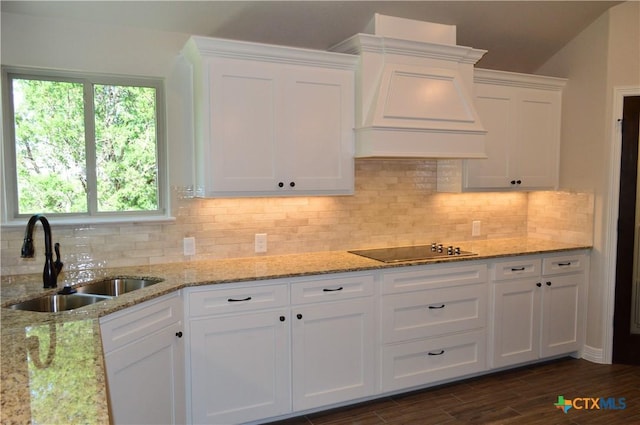 850 County Road 3152, Kempner, TX 76539 - kitchen featuring black electric cooktop, custom exhaust hood, white cabinets, and tasteful backsplash