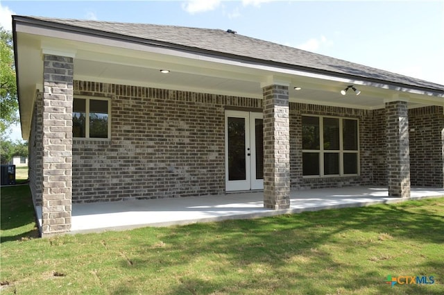 850 County Road 3152, Kempner, TX 76539 - back of property with brick siding, a patio, and a lawn