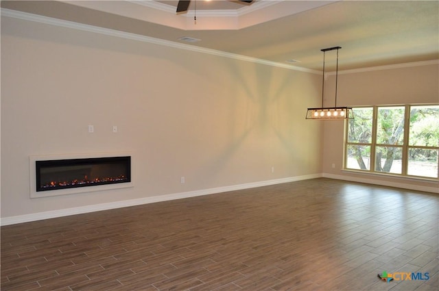 850 County Road 3152, Kempner, TX 76539 - unfurnished living room with dark wood-type flooring, ornamental molding, a lit fireplace, and a ceiling fan
