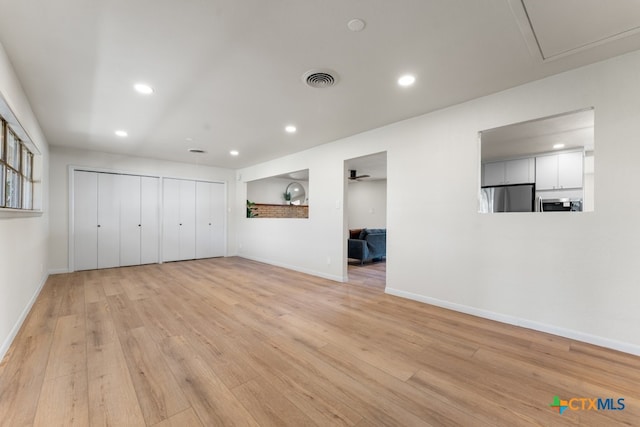 unfurnished living room featuring light hardwood / wood-style flooring