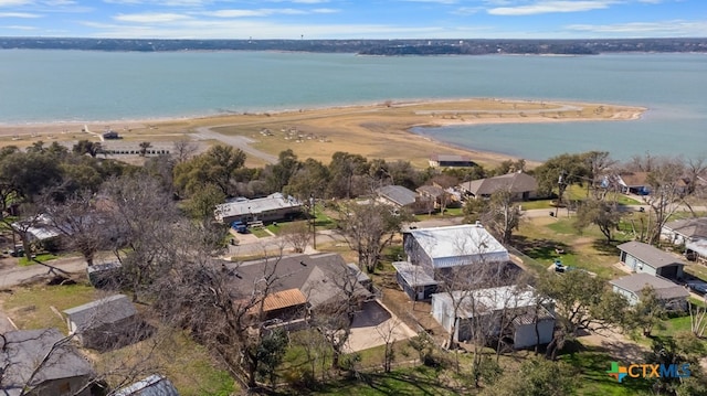 drone / aerial view featuring a view of the beach and a water view