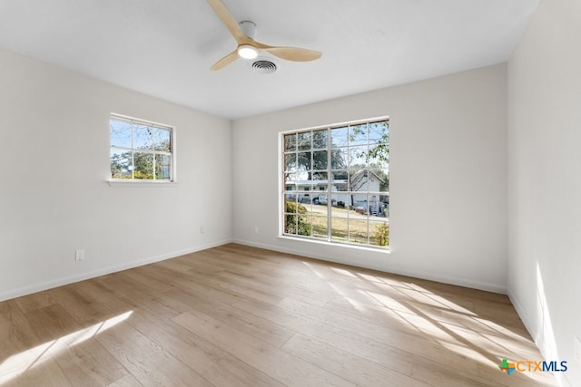 unfurnished room with ceiling fan and light wood-type flooring