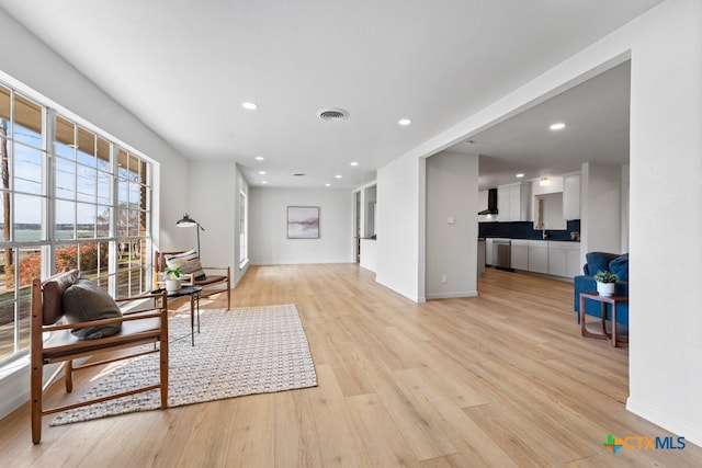 sitting room featuring light wood-type flooring