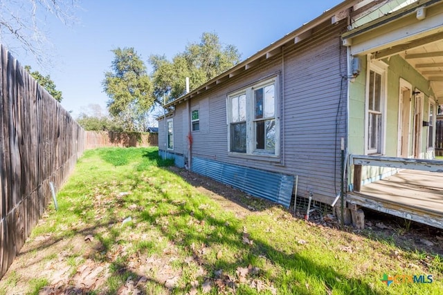 view of property exterior with a yard