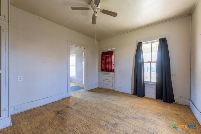 unfurnished bedroom with ceiling fan and light hardwood / wood-style floors