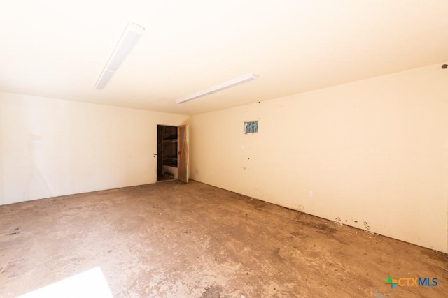 spare room with concrete flooring