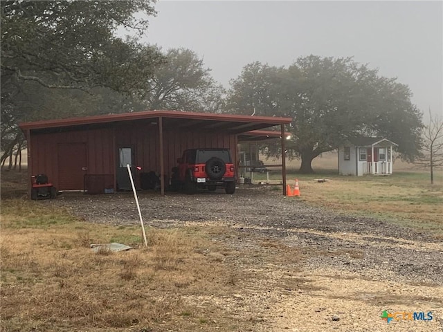 view of outbuilding featuring an outbuilding and driveway