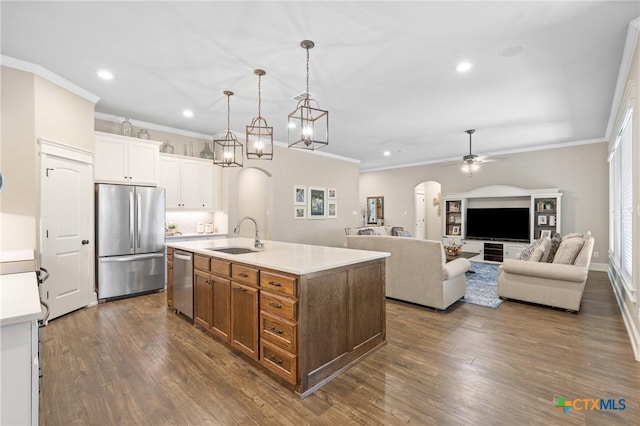 6319 Drexel Loop, Temple, TX 76502 - kitchen with stainless steel appliances, arched walkways, recessed lighting, light countertops, and ceiling fan