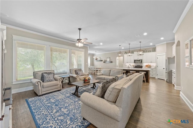 6319 Drexel Loop, Temple, TX 76502 - living area featuring ornamental molding, a ceiling fan, recessed lighting, and wood finished floors