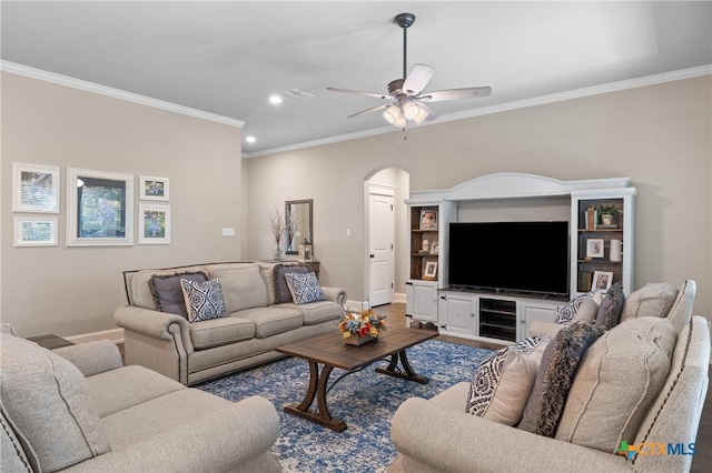 6319 Drexel Loop, Temple, TX 76502 - living area with crown molding, arched walkways, recessed lighting, ceiling fan, and wine cooler