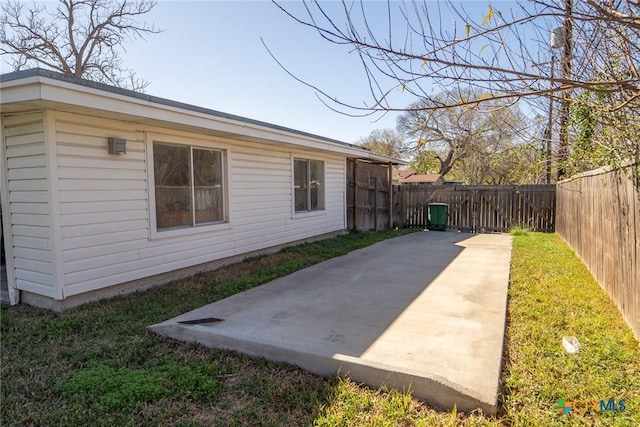 view of side of property featuring a patio