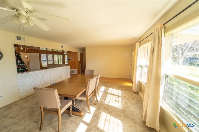 tiled dining room with ceiling fan